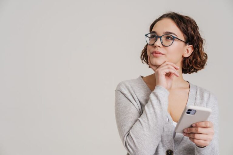 woman thinking with phone