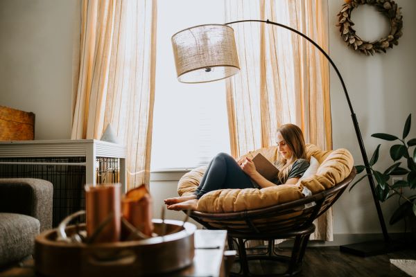 fall indoor home - girl reading in chair
