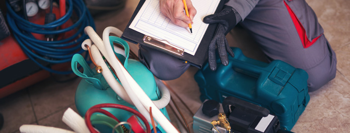 hvac tech with clipboard