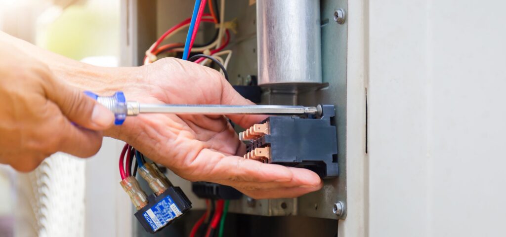 Furnace Repair - tech working on unit